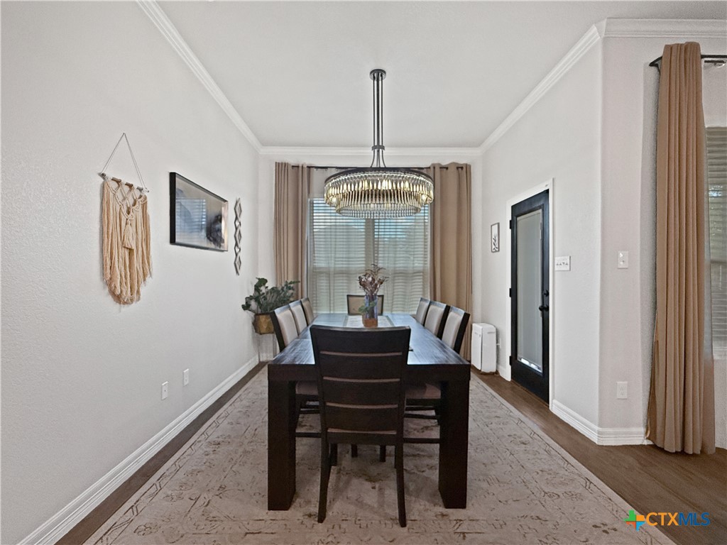 6123 Parma Lane Temple, TX 76502 - Photo 15 of 44 a dining room with furniture window and wooden floor