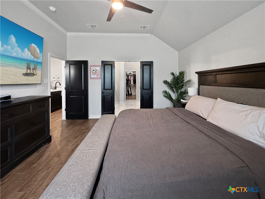 6123 Parma Lane Temple, TX 76502 - Photo 21 of 44 a bedroom with a large bed and a television