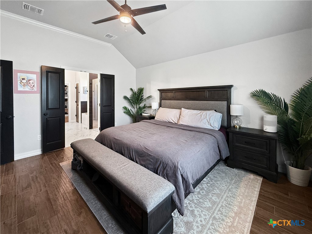 6123 Parma Lane Temple, TX 76502 - Photo 22 of 44 a bedroom with a bed and wooden floor