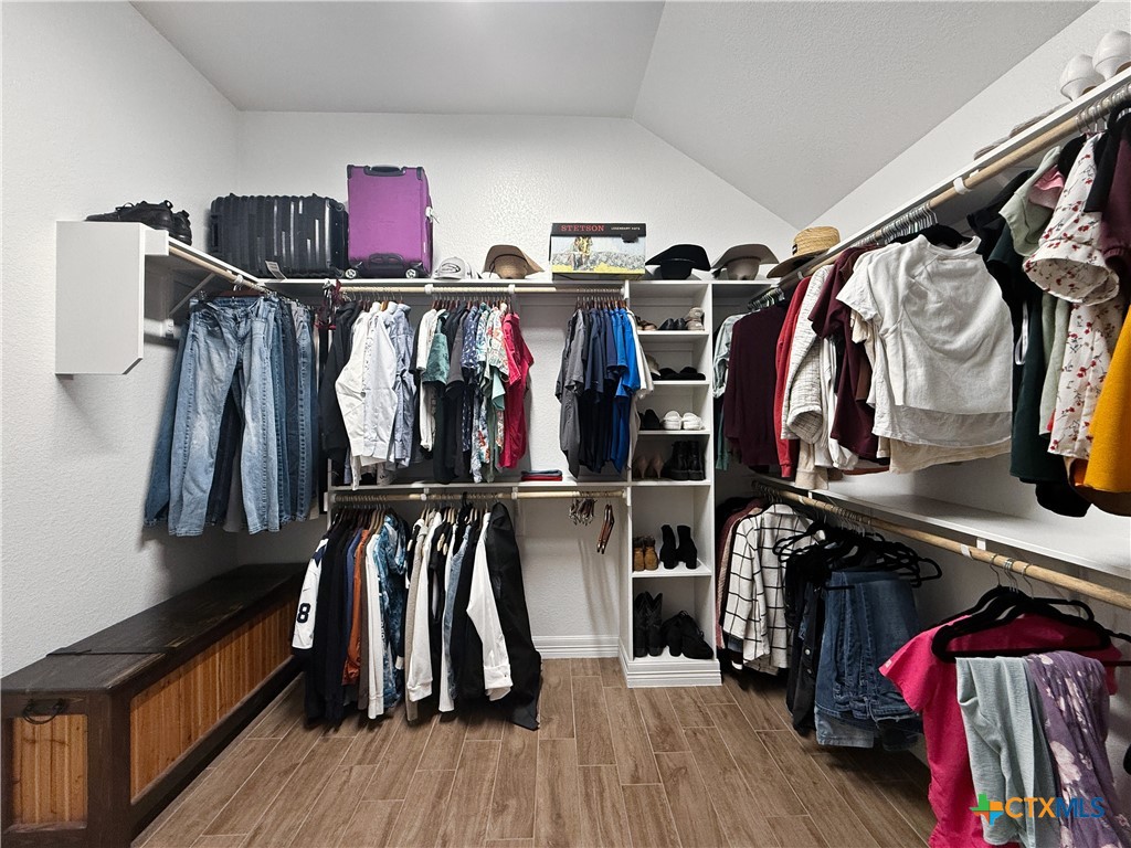 6123 Parma Lane Temple, TX 76502 - Photo 23 of 44 a view of walk in closet with clothes and shoes