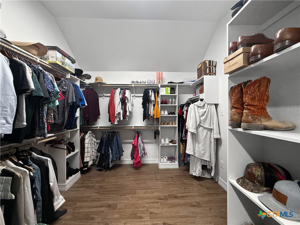 6123 Parma Lane Temple, TX 76502 - Photo 24 of 44 a view of walk in closet with clothes and shoes