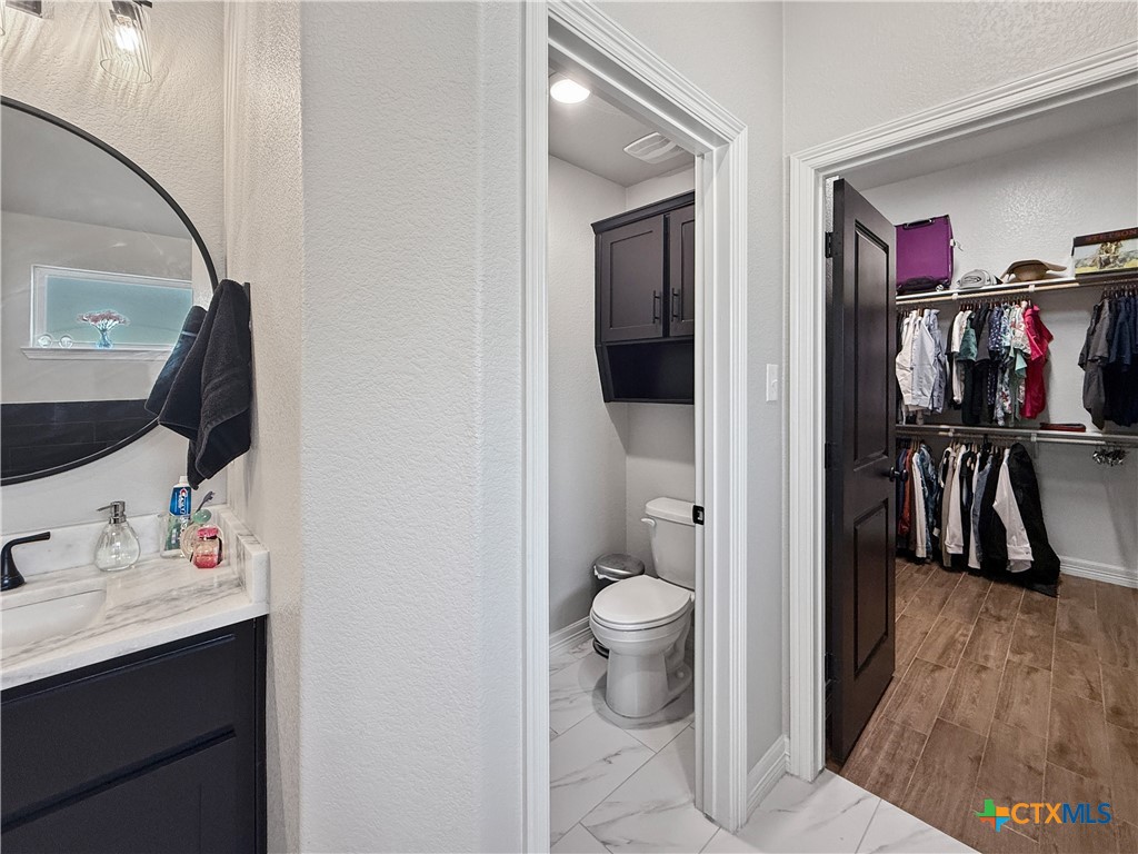 6123 Parma Lane Temple, TX 76502 - Photo 25 of 44 a bathroom with a sink and a mirror