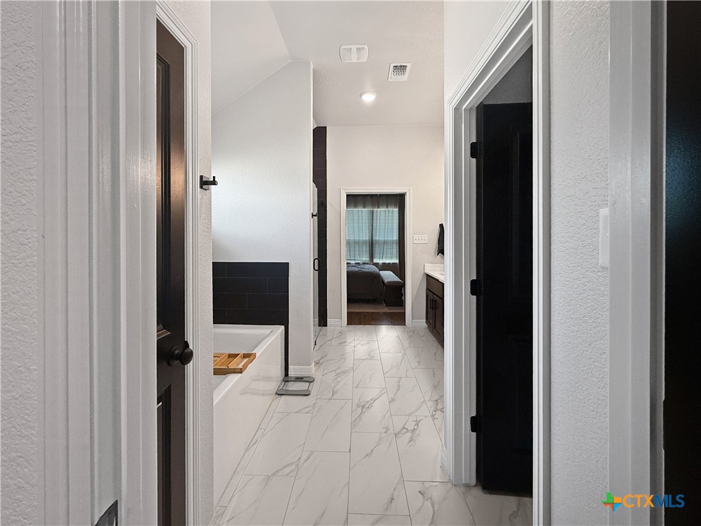 6123 Parma Lane Temple, TX 76502 - Photo 28 of 44 a view of a hallway with living room and dining room view