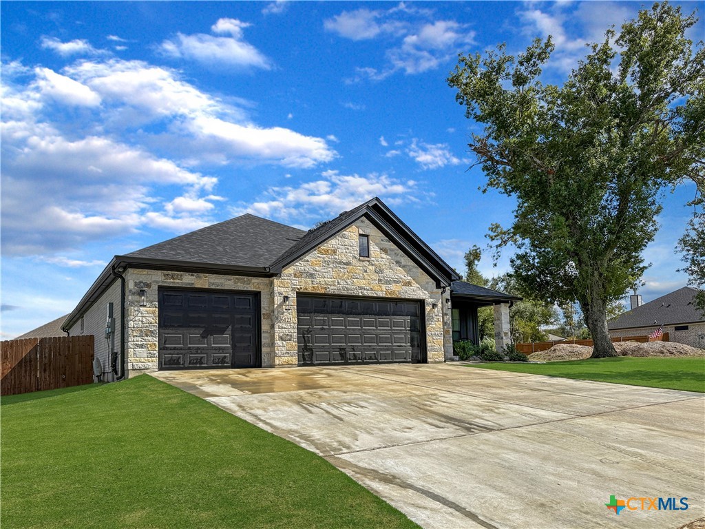6123 Parma Lane Temple, TX 76502 - Photo 3 of 44 a front view of a house with yard and garage