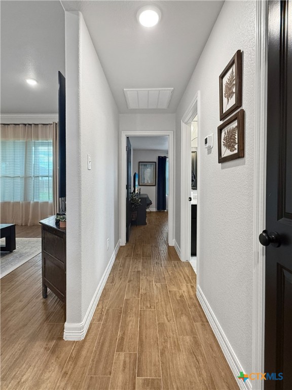 6123 Parma Lane Temple, TX 76502 - Photo 6 of 44 a view of a hallway with wooden floor and furniture