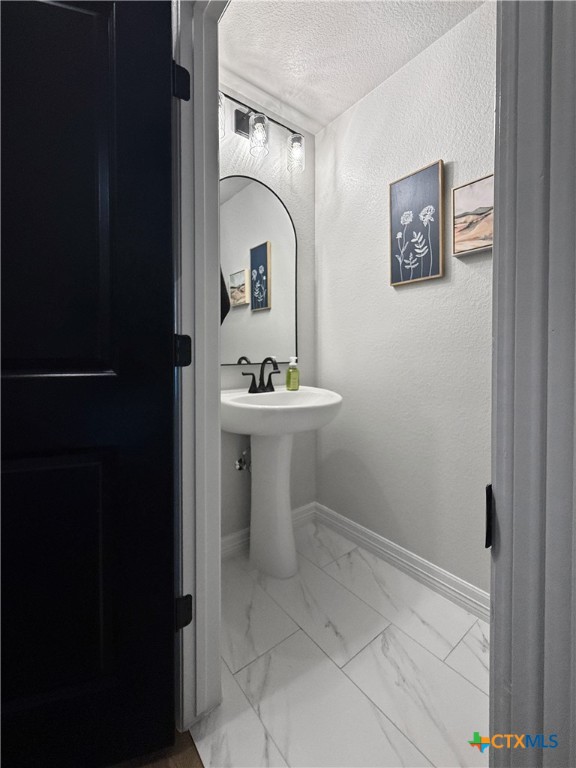 6123 Parma Lane Temple, TX 76502 - Photo 7 of 44 a bathroom with a sink and a mirror