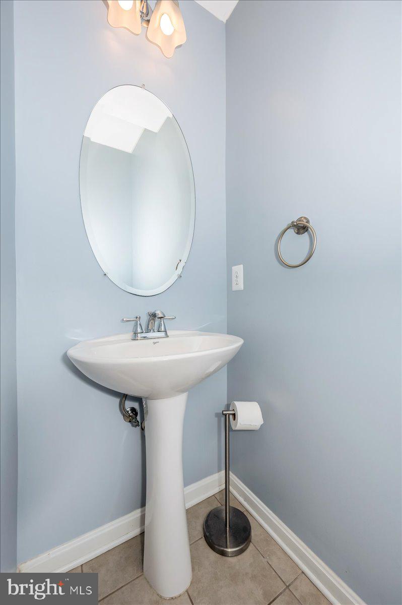 1806 Monocacy View Circle, Unit 41A Frederick, MD 21701 - Photo 21 of 59 a bathroom with a sink and a mirror