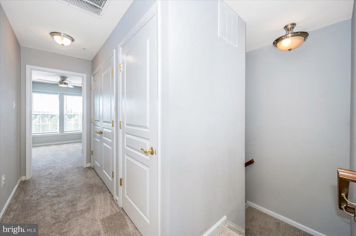 1806 Monocacy View Circle, Unit 41A Frederick, MD 21701 - Photo 23 of 59 a view of a hallway with wooden floor