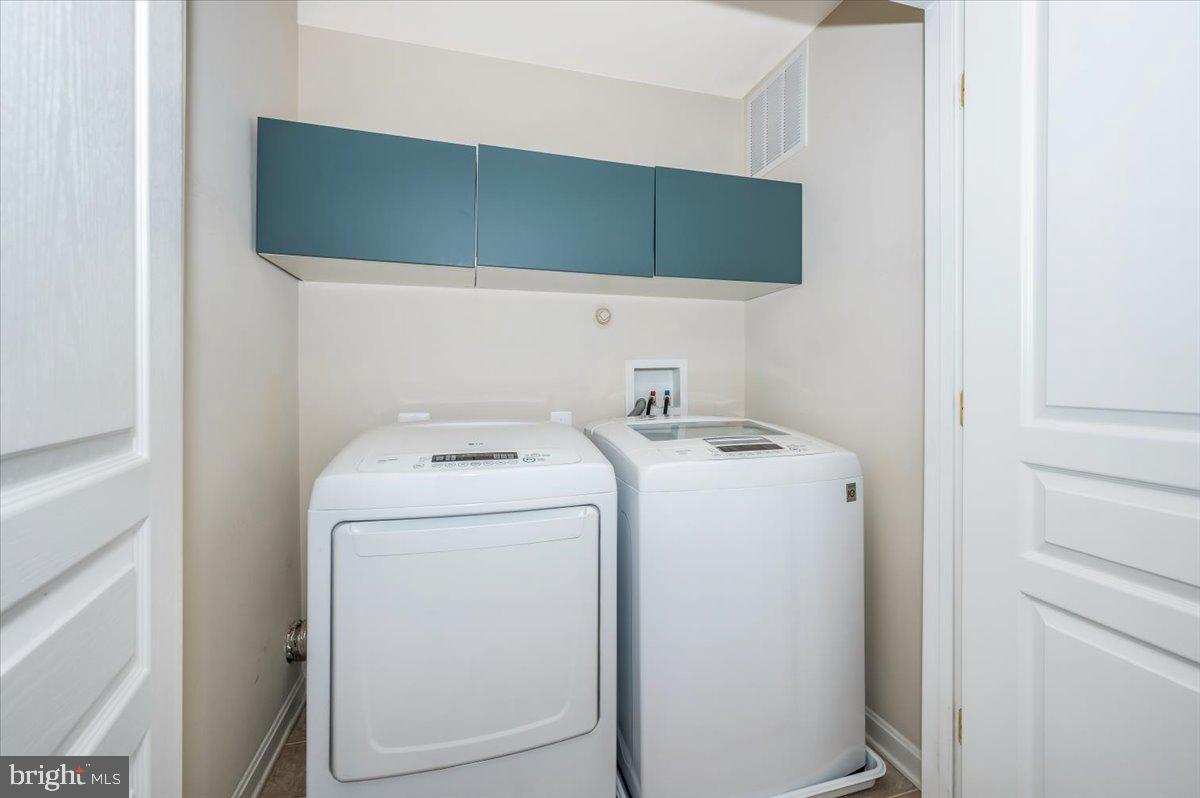 1806 Monocacy View Circle, Unit 41A Frederick, MD 21701 - Photo 24 of 59 a utility room with dryer and washer
