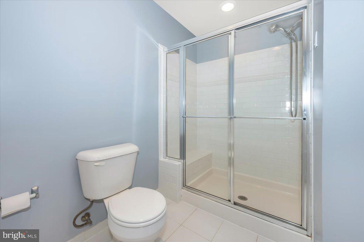 1806 Monocacy View Circle, Unit 41A Frederick, MD 21701 - Photo 33 of 59 a white toilet sitting next to a bathroom sink