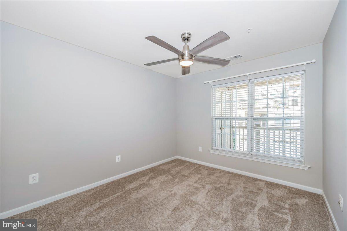 1806 Monocacy View Circle, Unit 41A Frederick, MD 21701 - Photo 42 of 59 an empty room with a window and a fan