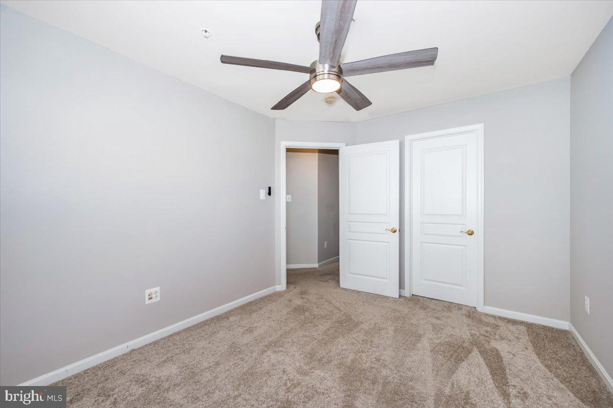 1806 Monocacy View Circle, Unit 41A Frederick, MD 21701 - Photo 43 of 59 a view of a room with a ceiling fan and a window