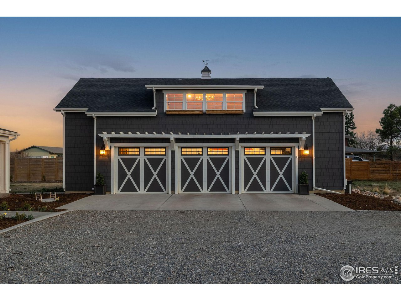 6685 Baseline Road Boulder, CO 80303 - Photo 11 of 38 a front view of a house with large windows
