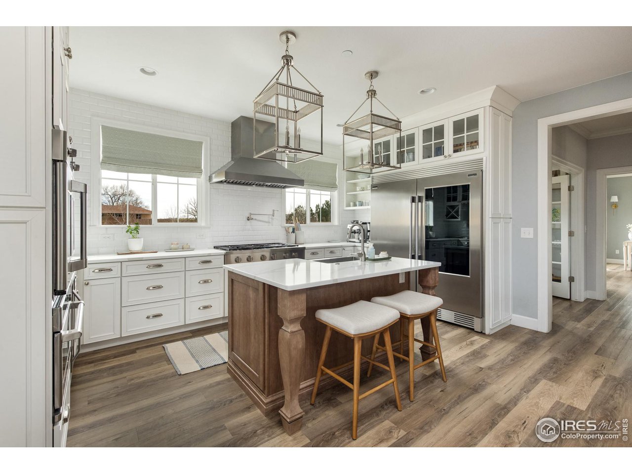 6685 Baseline Road Boulder, CO 80303 - Photo 12 of 38 a kitchen with stainless steel appliances a sink and cabinets