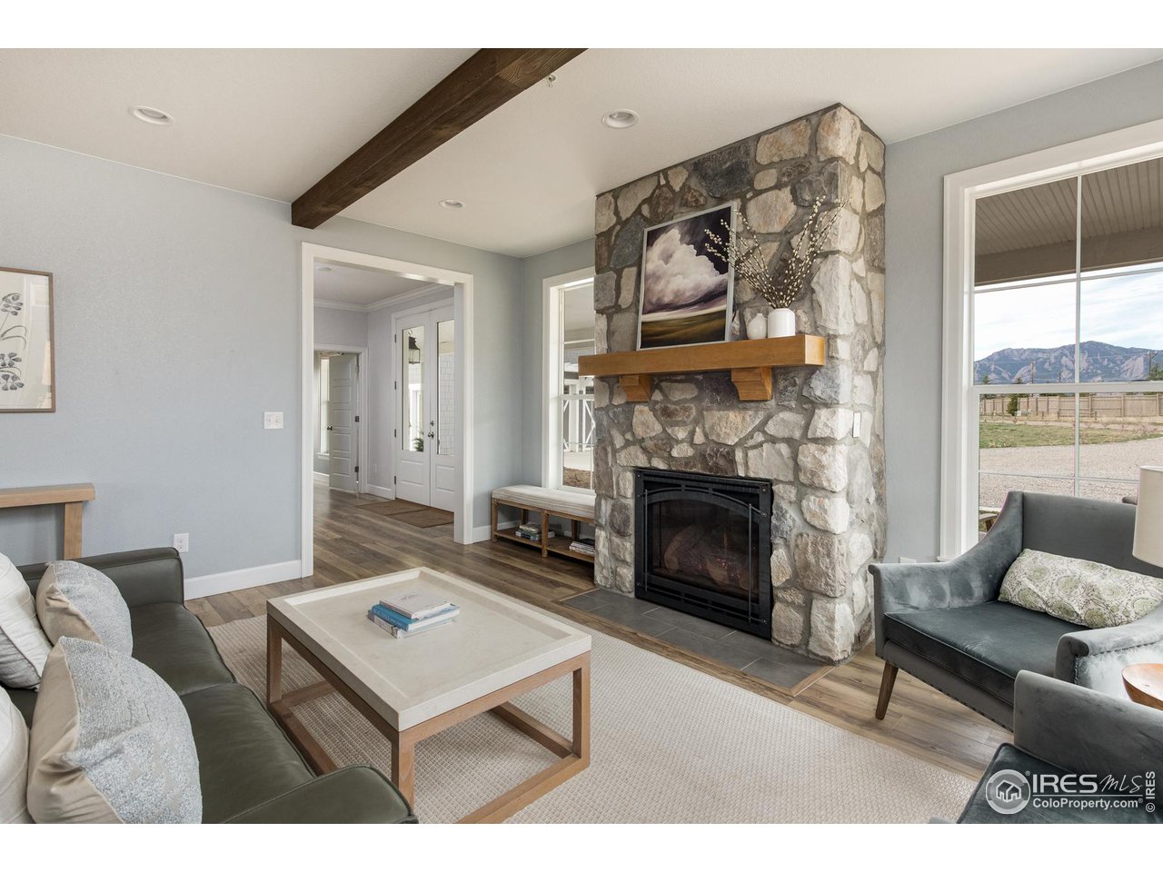 6685 Baseline Road Boulder, CO 80303 - Photo 14 of 38 a living room with furniture a flat screen tv and a fireplace