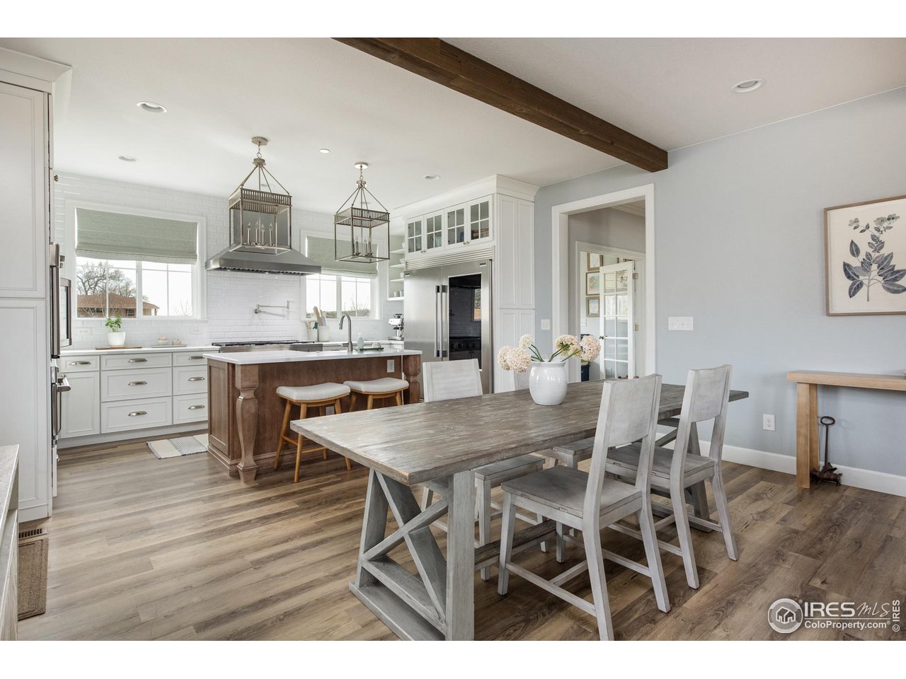 6685 Baseline Road Boulder, CO 80303 - Photo 16 of 38 a view of a dining room with furniture and wooden floor