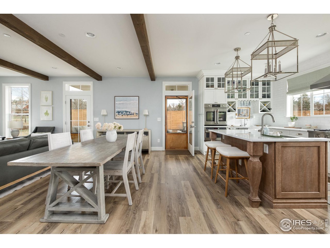 6685 Baseline Road Boulder, CO 80303 - Photo 17 of 38 a dining hall with stainless steel appliances kitchen island granite countertop a dining table chairs and granite counter tops