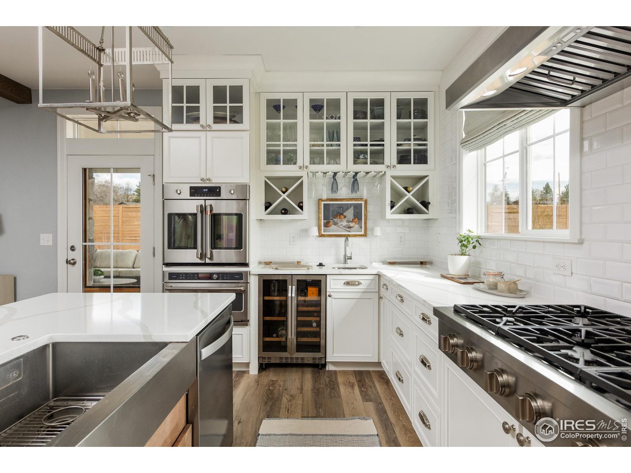 6685 Baseline Road Boulder, CO 80303 - Photo 18 of 38 a kitchen with stainless steel appliances granite countertop a stove and a sink