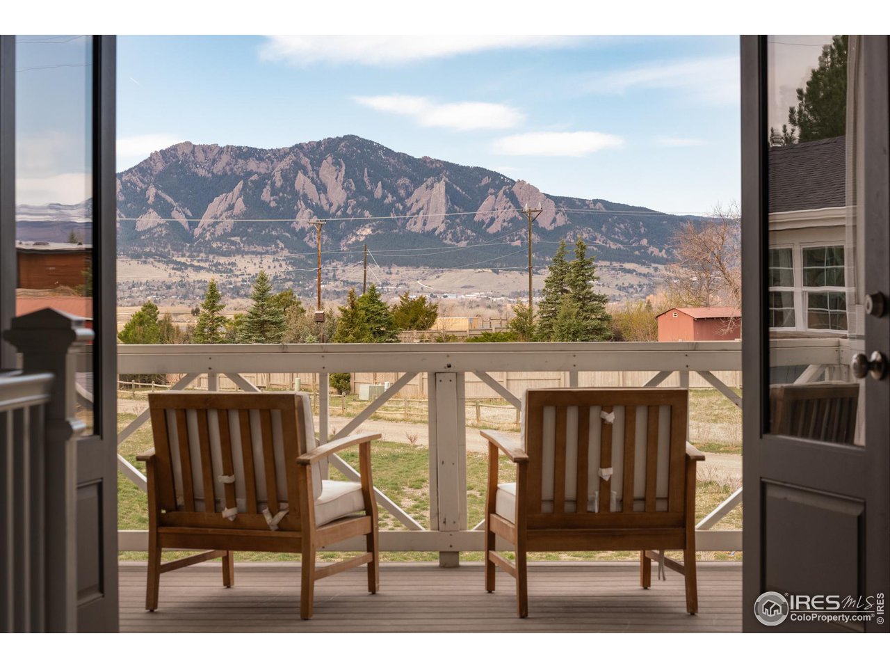 6685 Baseline Road Boulder, CO 80303 - Photo 22 of 38 a view of a chairs and table in the balcony