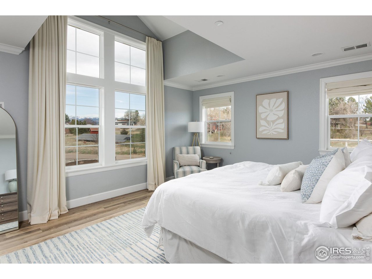 6685 Baseline Road Boulder, CO 80303 - Photo 24 of 38 a bedroom with a large bed and a large window