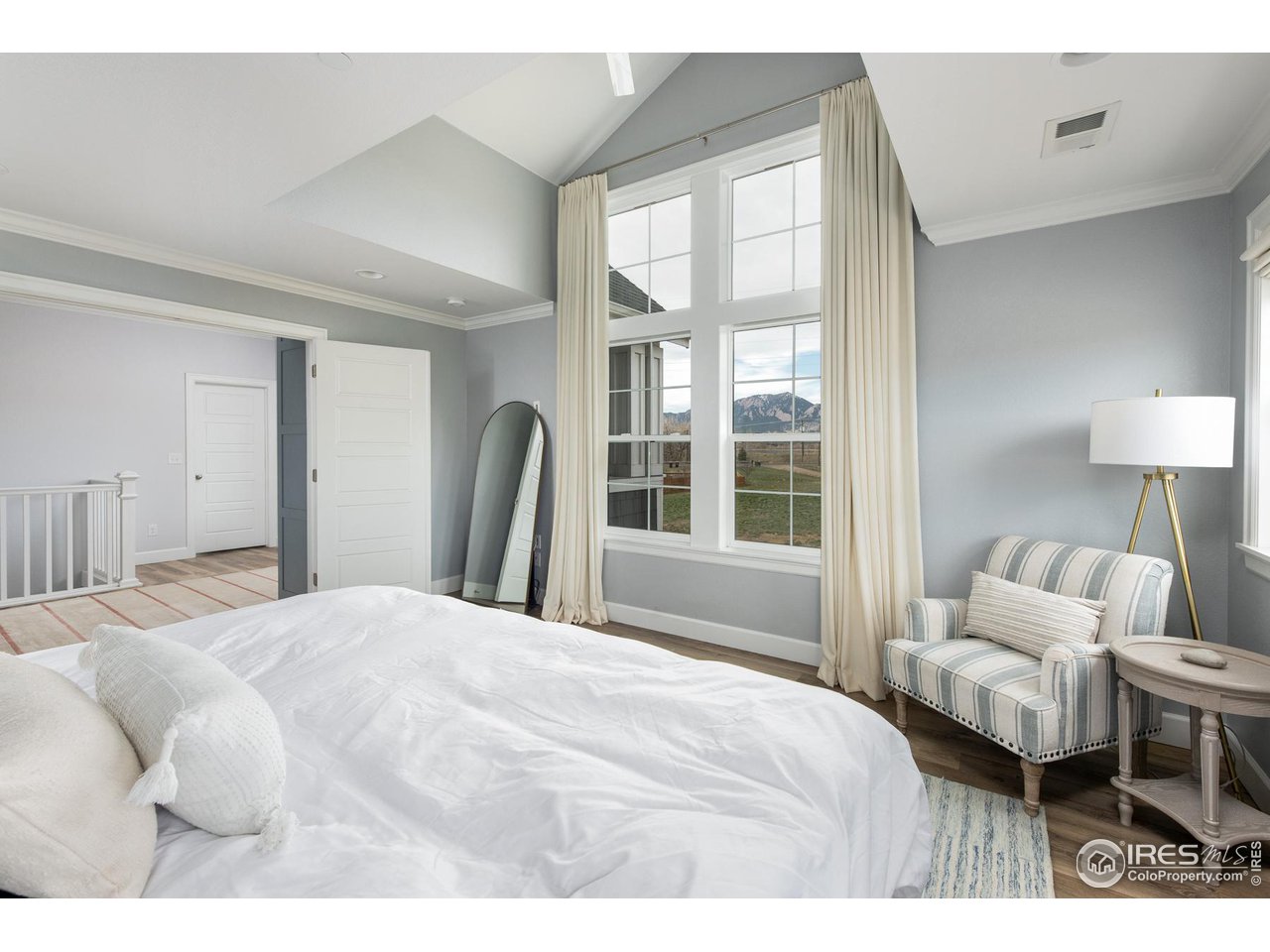 6685 Baseline Road Boulder, CO 80303 - Photo 25 of 38 a bedroom with a bed and a large window