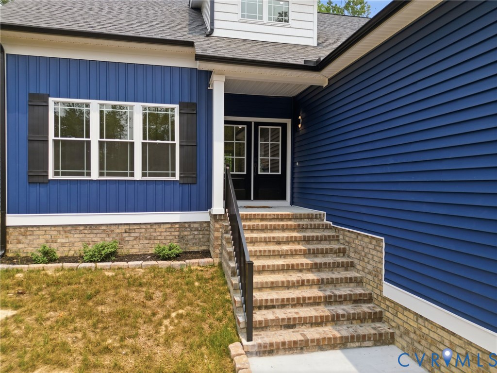 239 Bumpass Road Bumpass, VA 23024 - Photo 42 of 44 Vibrant blue siding exterior featuring a covered e