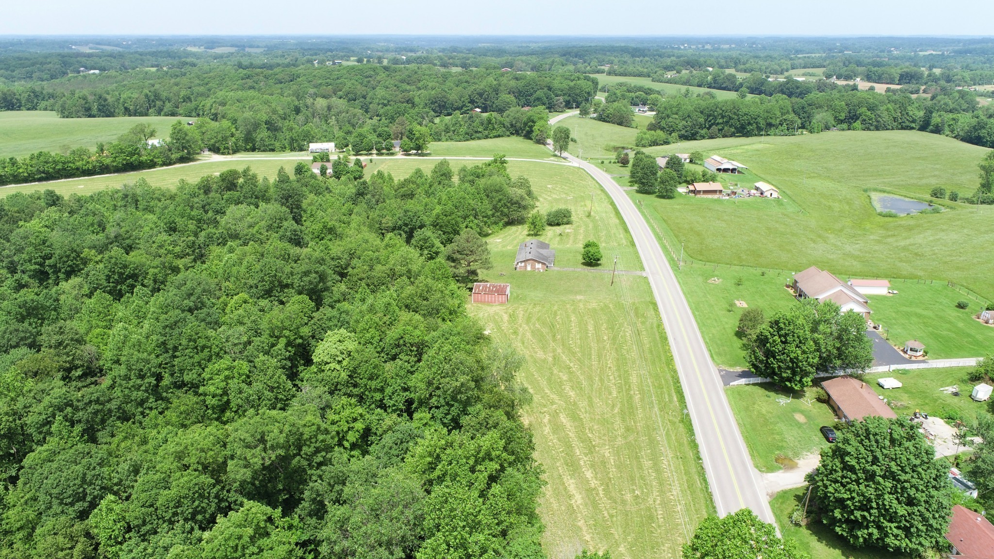8 Whitson Hollow Road Red Boiling Springs, TN 37150 - Photo 4 of 5 an aerial view of green landscape with trees houses and mountain view