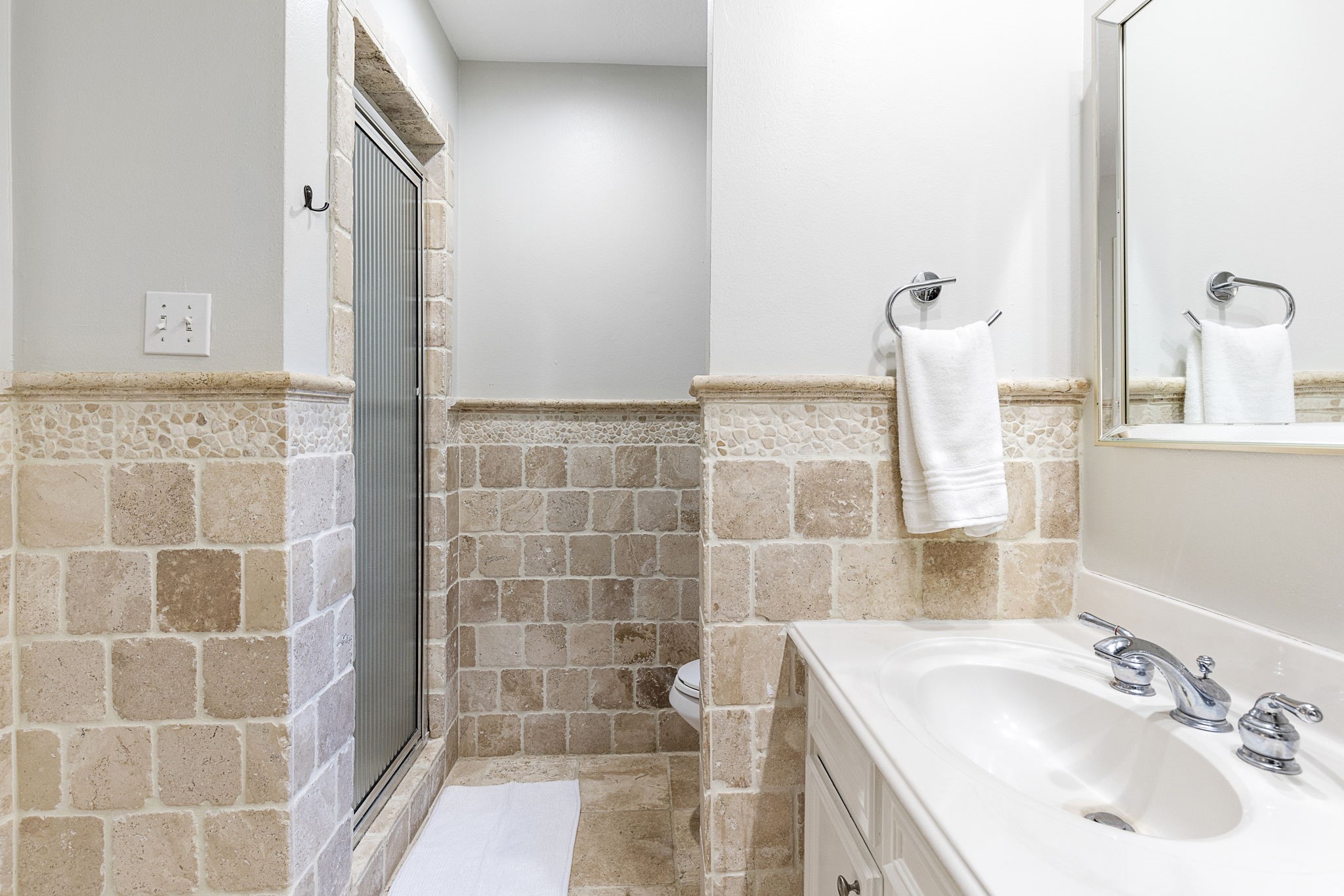 623 Hickory Ridge Drive Shenandoah, TX 77381 - Photo 21 of 26 a bathroom with a sink and a mirror