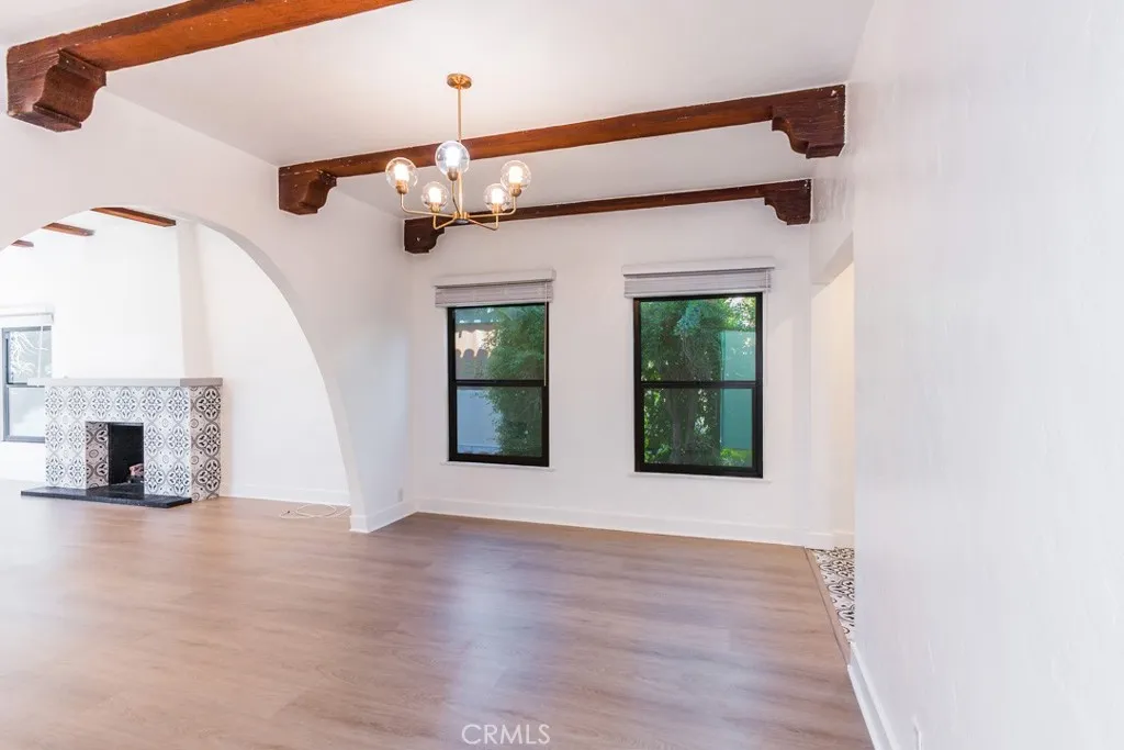 128 South Harper Avenue, Unit 130 Los Angeles, CA 90048 - Photo 11 of 43 a view of an empty room with window and fireplace