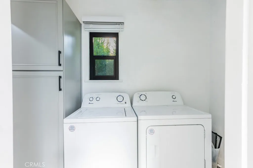 128 South Harper Avenue, Unit 130 Los Angeles, CA 90048 - Photo 18 of 43 a utility room with dryer and washer