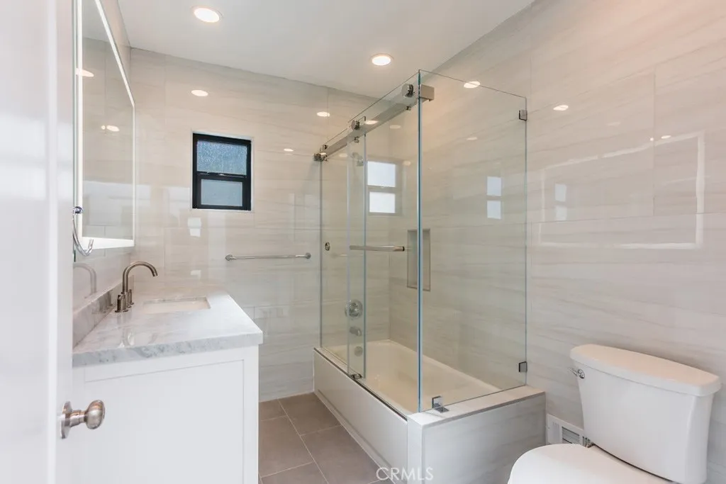 128 South Harper Avenue, Unit 130 Los Angeles, CA 90048 - Photo 29 of 43 a bathroom with a sink toilet and shower
