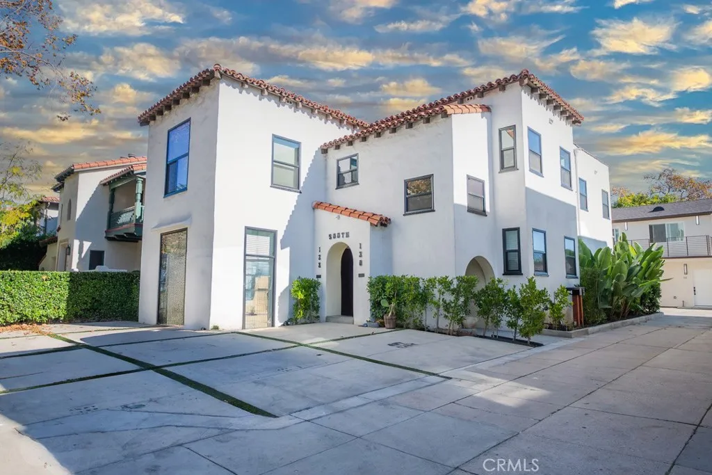128 South Harper Avenue, Unit 130 Los Angeles, CA 90048 - Photo 3 of 43 a front view of a house with a yard