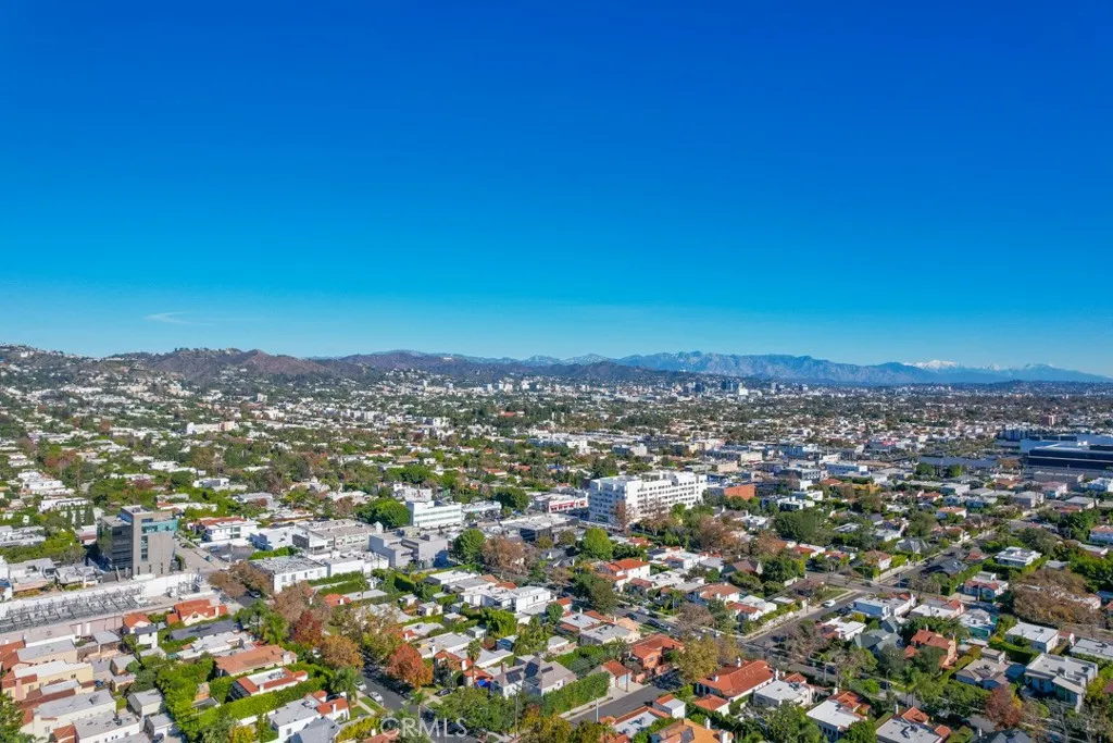 128 South Harper Avenue, Unit 130 Los Angeles, CA 90048 - Photo 42 of 43 an aerial view of residential building and trees around