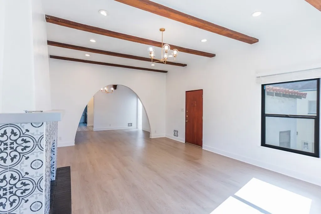 128 South Harper Avenue, Unit 130 Los Angeles, CA 90048 - Photo 7 of 43 a view of an empty room with a window