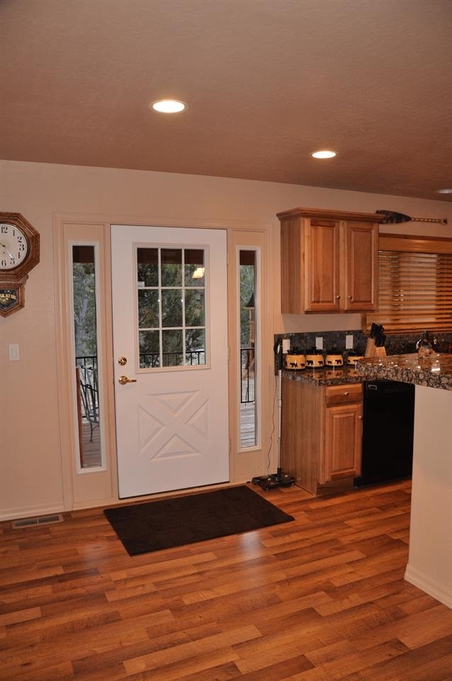 2253 Cross Country Road Overgaard, AZ 85933 - Photo 19 of 33 a view of a kitchen with wooden floor and a window