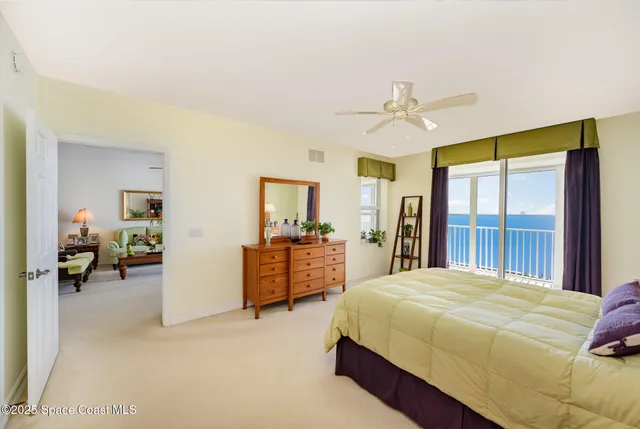 a bedroom with a bed dresser and a window