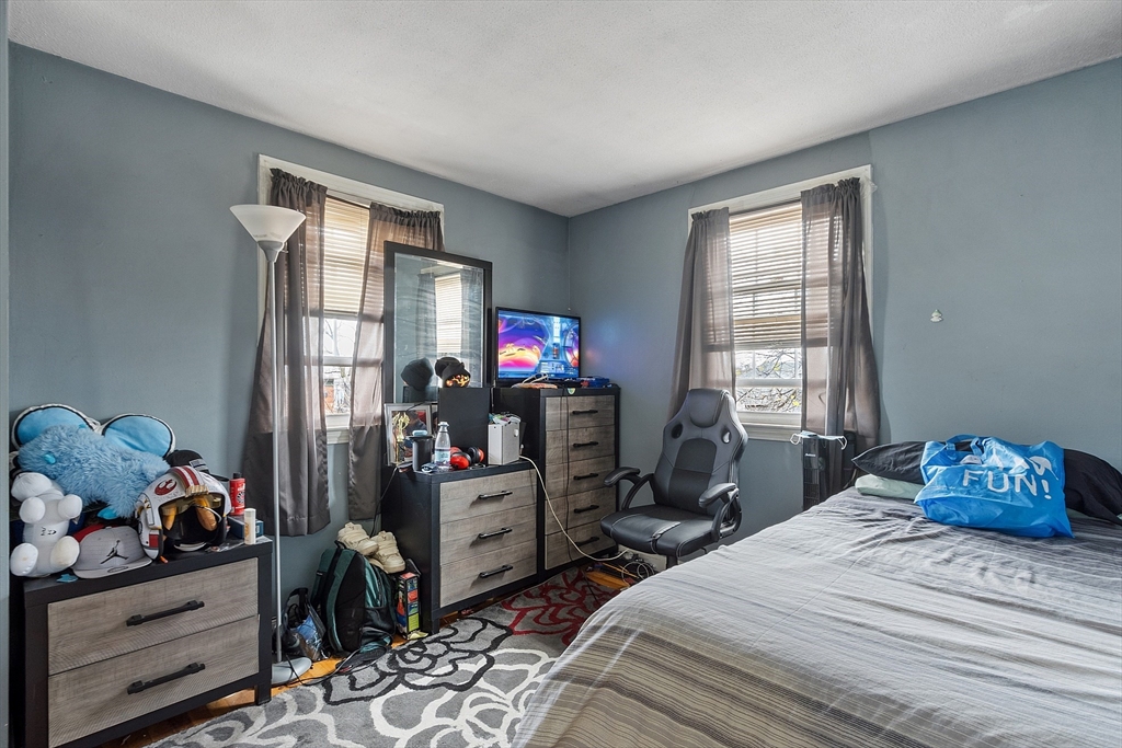 10 Everett Avenue Boston, MA 02125 - Photo 19 of 42 a bedroom with a bed and a window