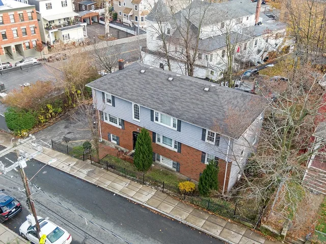 a aerial view of a house with a yard