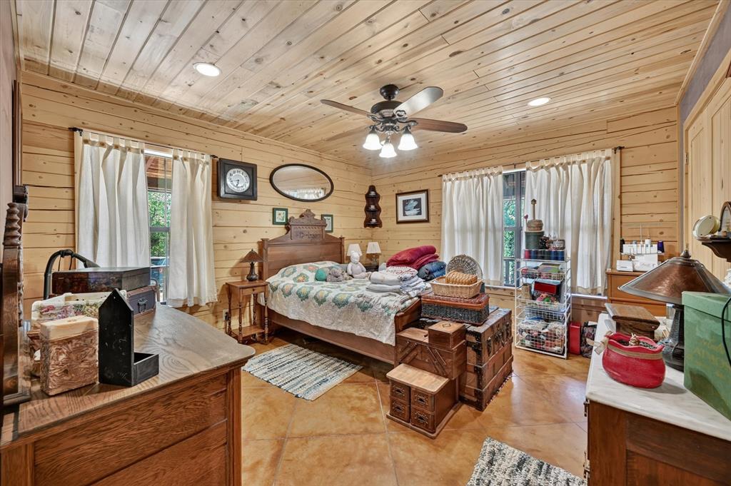 1623 3 Skillet Road Springtown, TX 76082 - Photo 25 of 40 Wood-paneled walls and ceiling, recessed lighting, ceiling fan, and stained concrete flooring