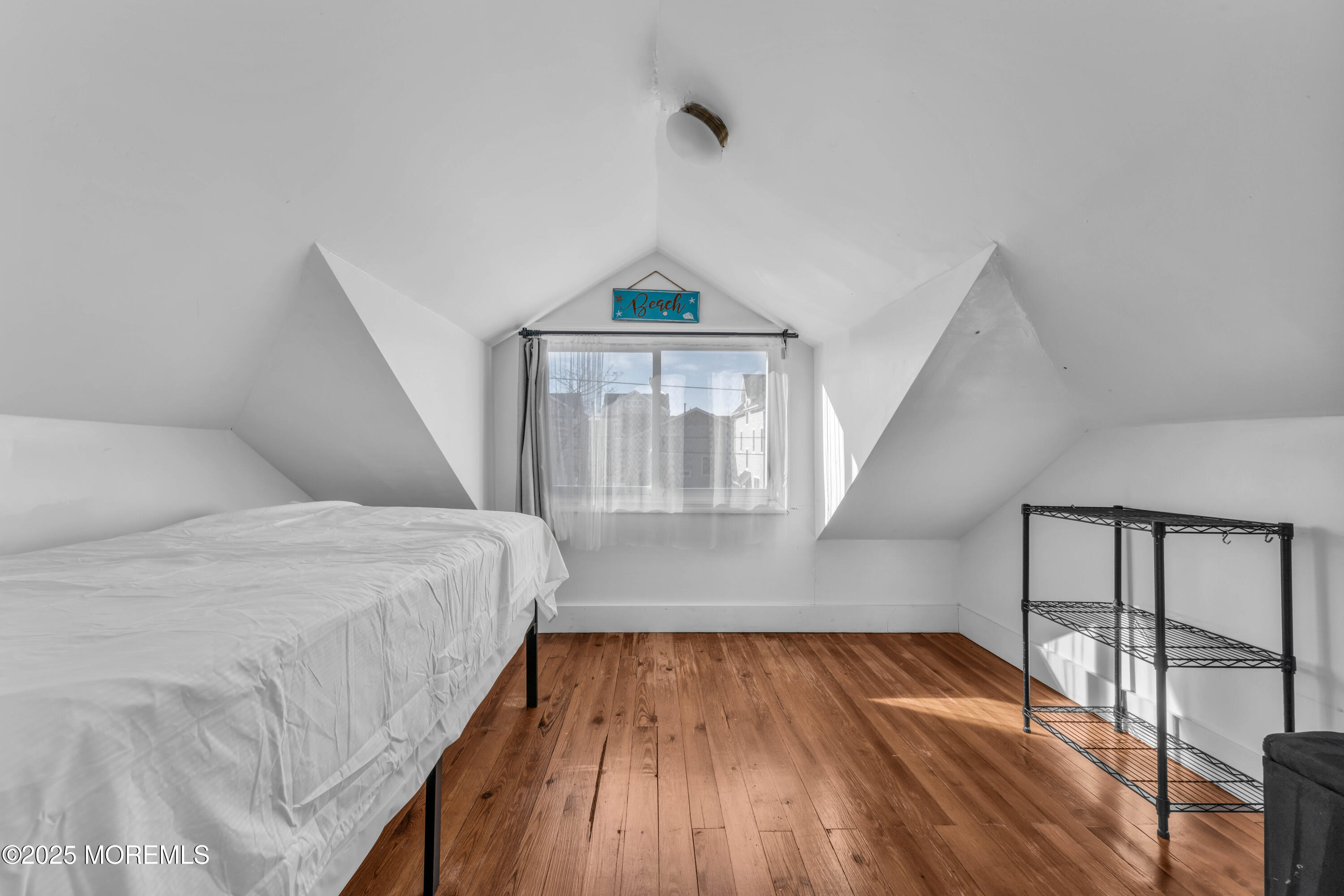 116 15th Avenue Belmar, NJ 07719 - Photo 11 of 21 a bedroom with a bed and a window