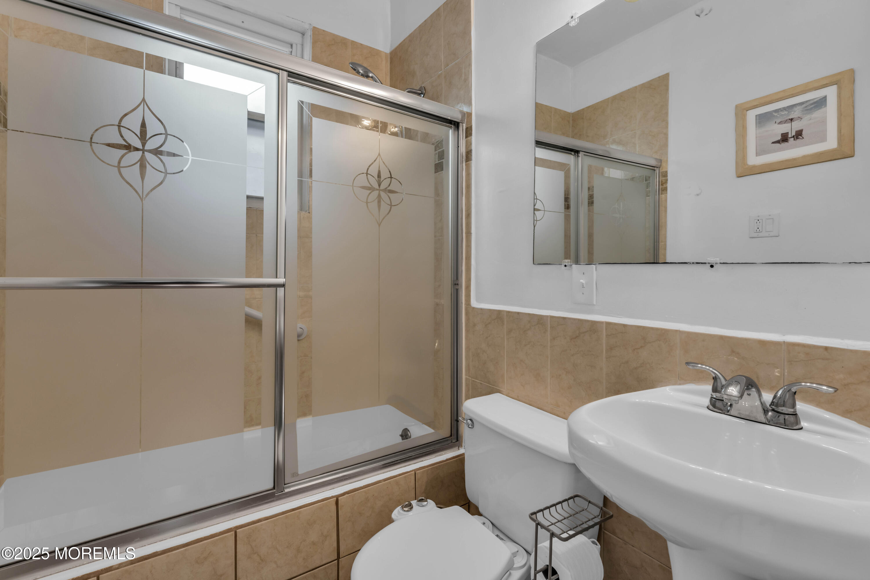 116 15th Avenue Belmar, NJ 07719 - Photo 4 of 21 a bathroom with a sink and a mirror