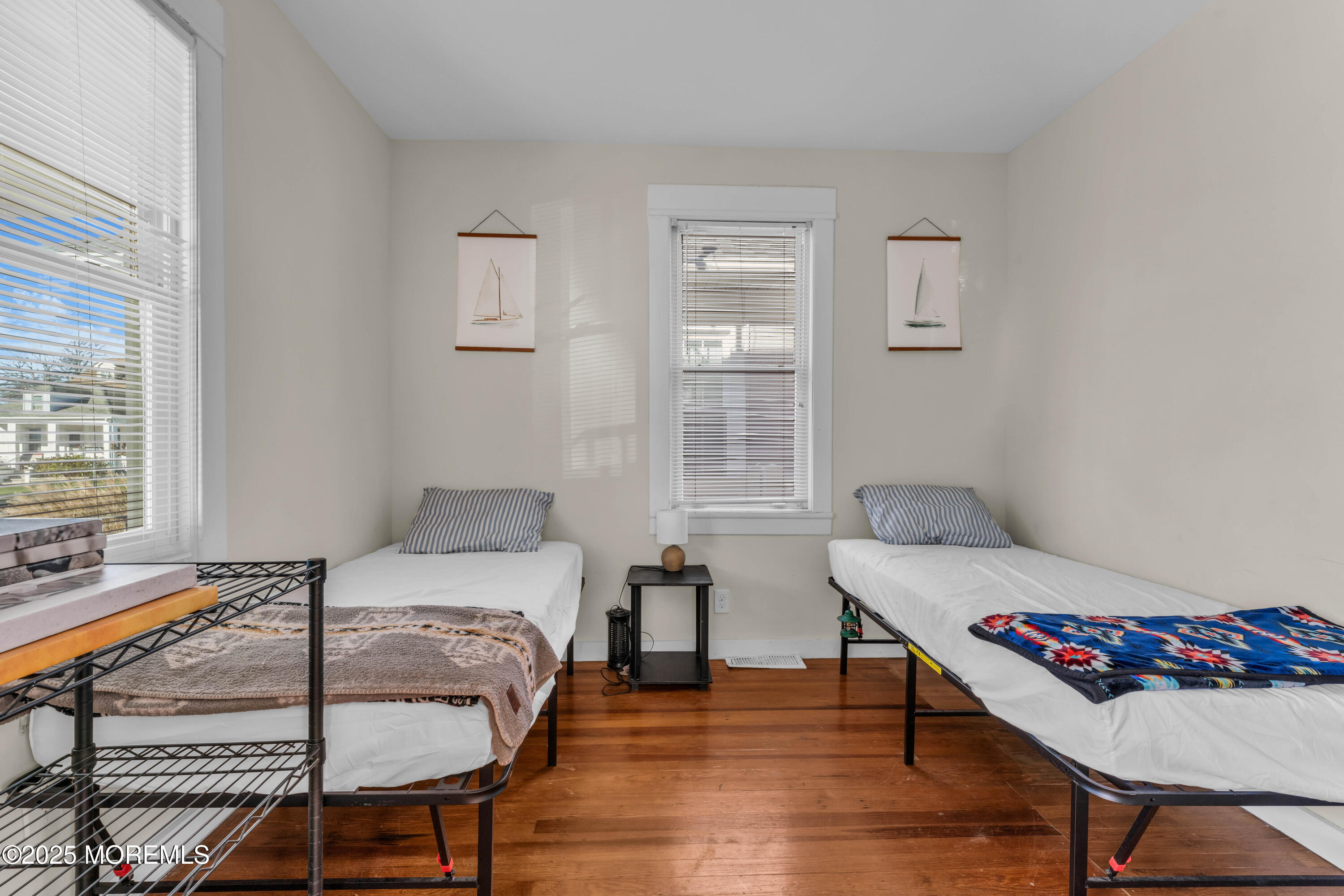 116 15th Avenue Belmar, NJ 07719 - Photo 7 of 21 a bedroom with a bed and a table