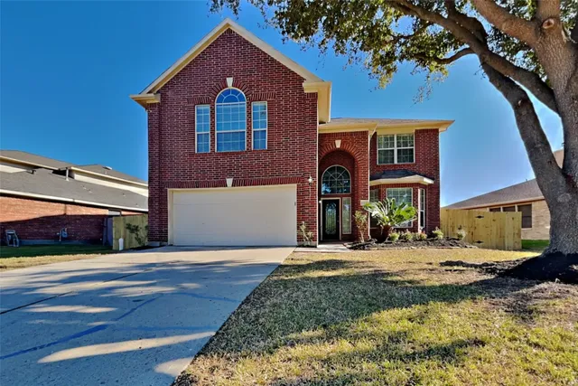 a front view of a house with yard