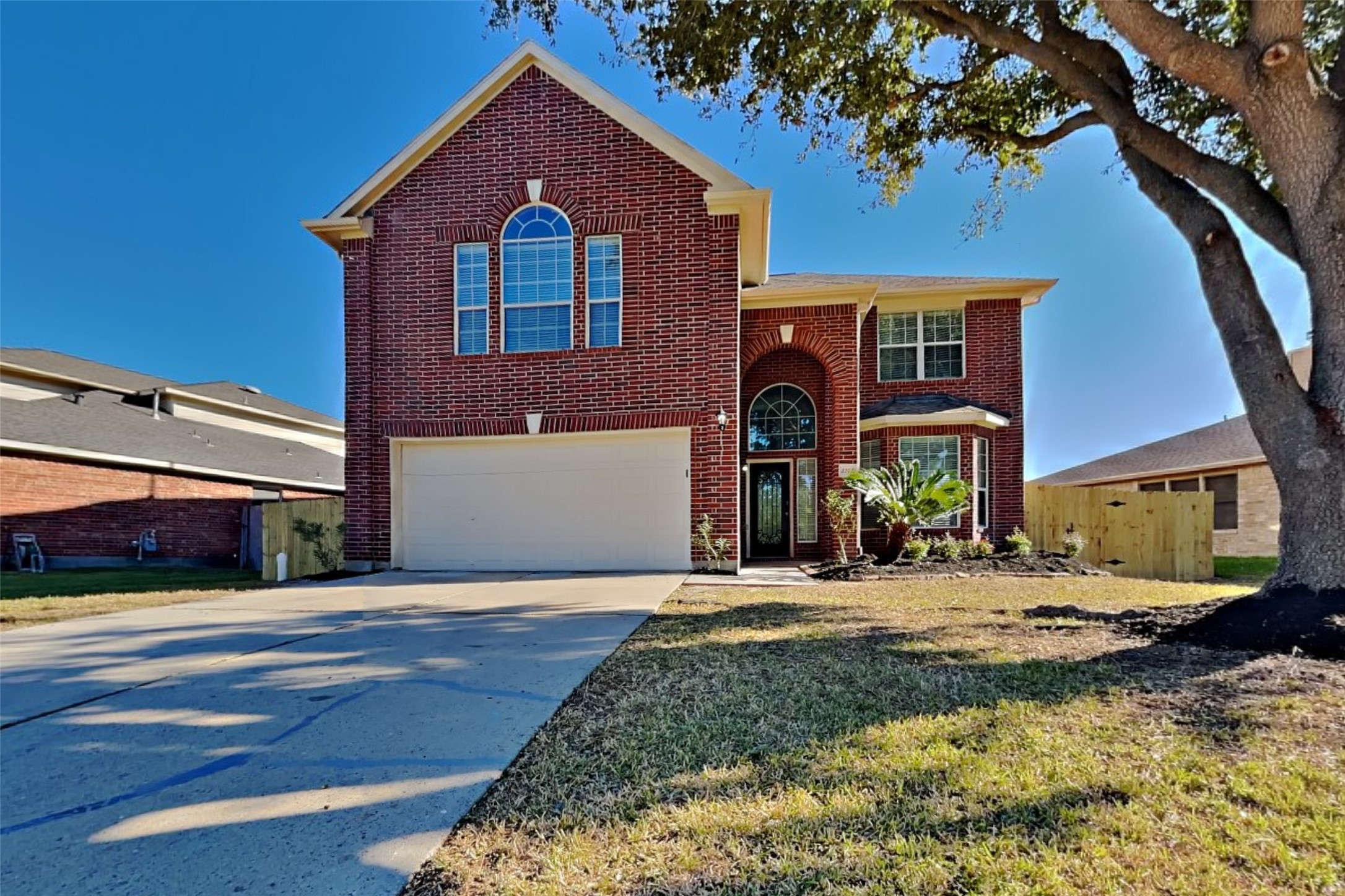 3242 Enchanted Hollow Lane Spring, TX 77388 - Photo 1 of 24 a front view of a house with yard
