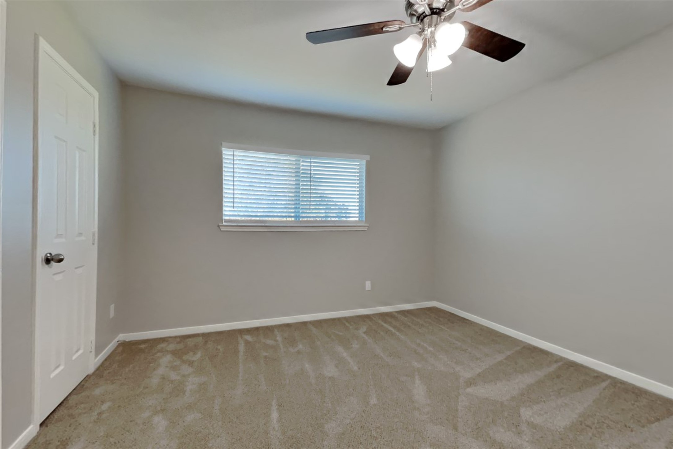 3242 Enchanted Hollow Lane Spring, TX 77388 - Photo 13 of 24 an empty room with a chandelier fan and windows