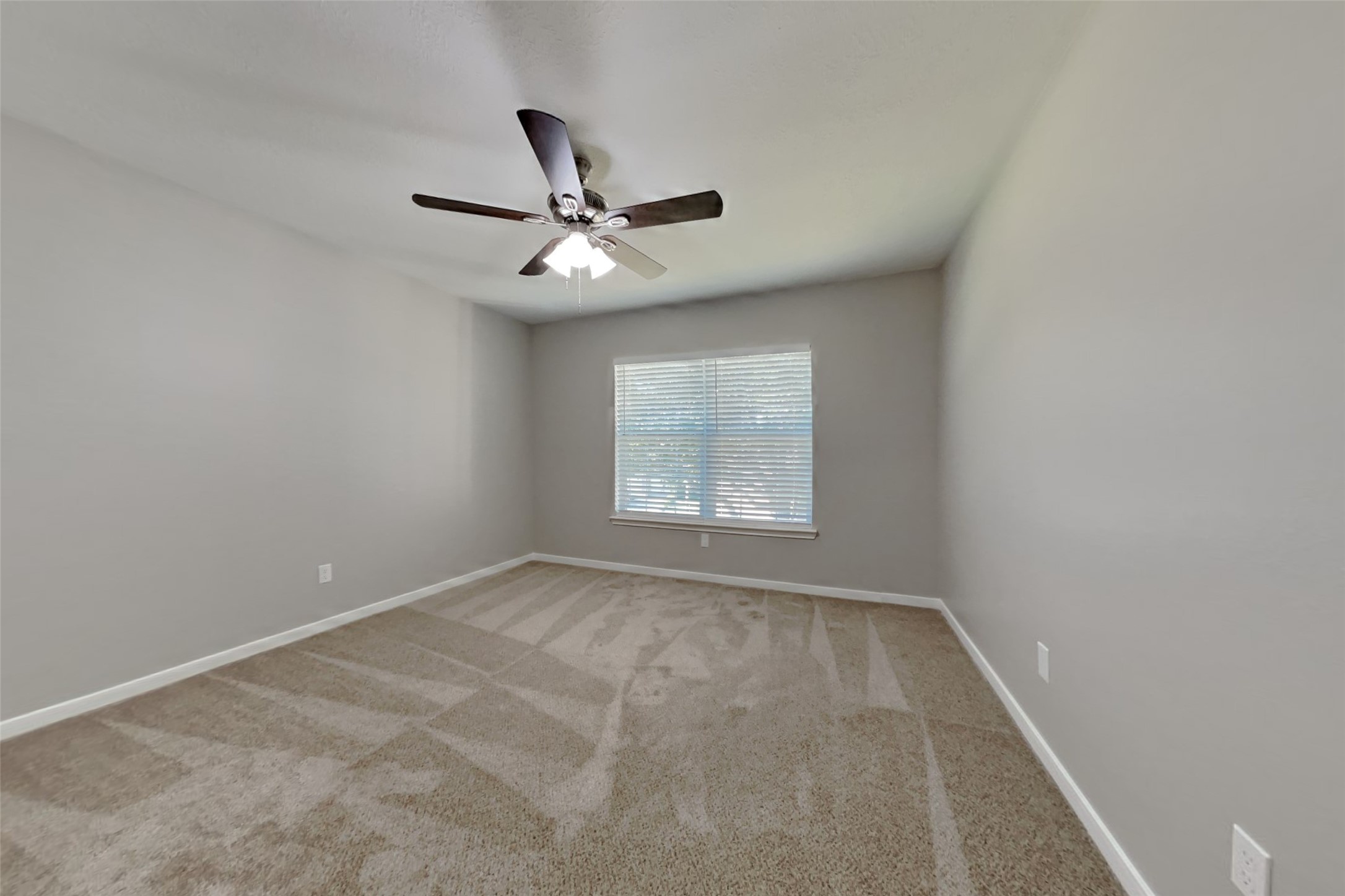 3242 Enchanted Hollow Lane Spring, TX 77388 - Photo 16 of 24 an empty room with a window and a fan
