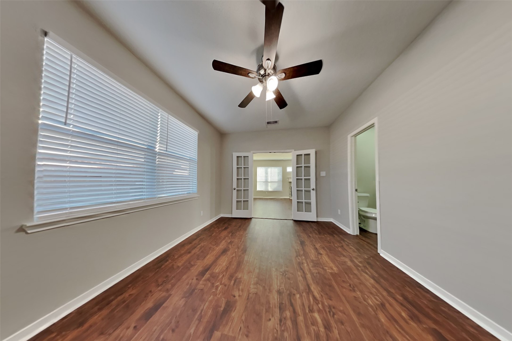 3242 Enchanted Hollow Lane Spring, TX 77388 - Photo 20 of 24 a view of empty room with wooden floor and fan