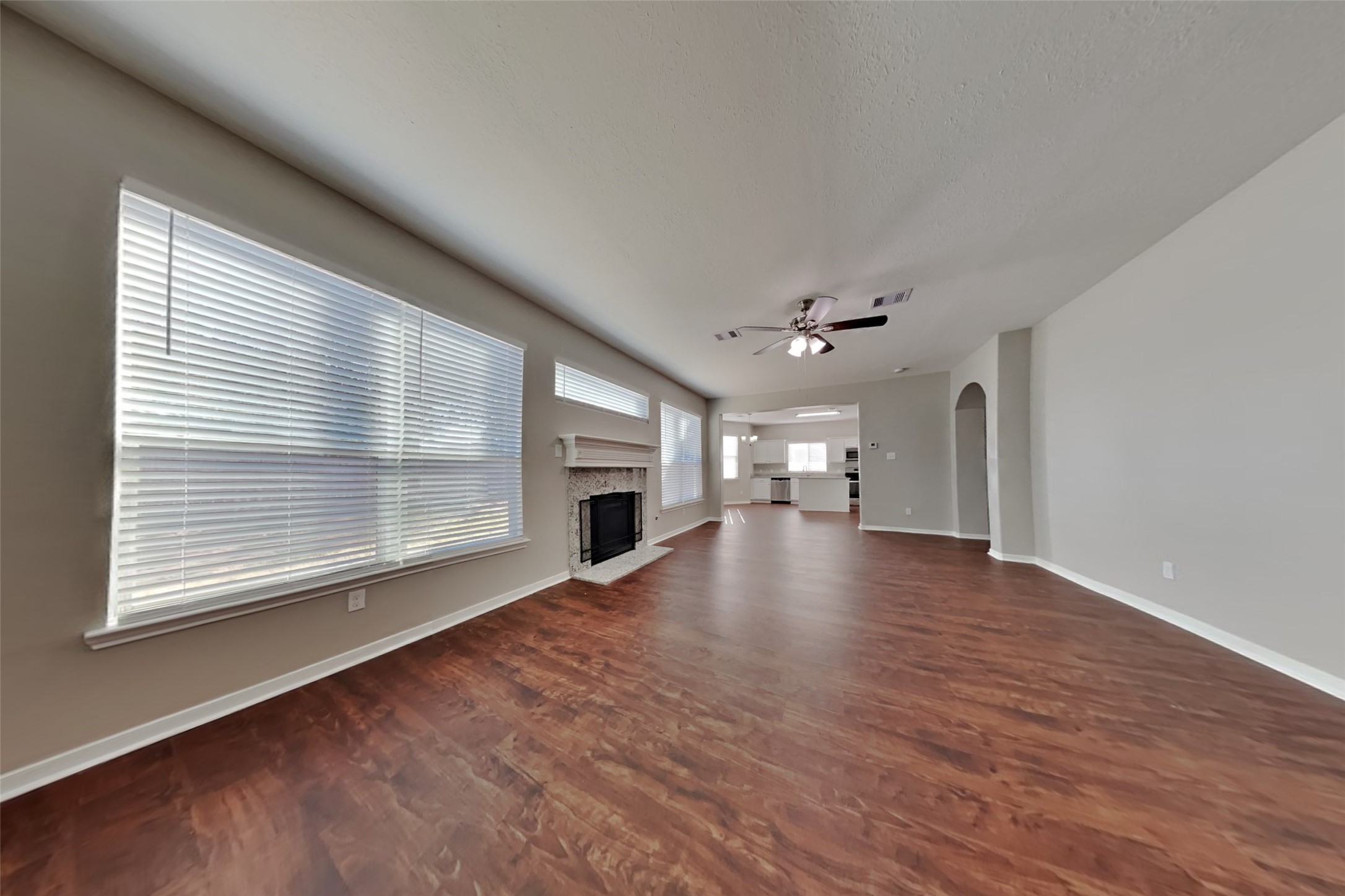 3242 Enchanted Hollow Lane Spring, TX 77388 - Photo 2 of 24 a view of empty room with wooden floor and fireplace