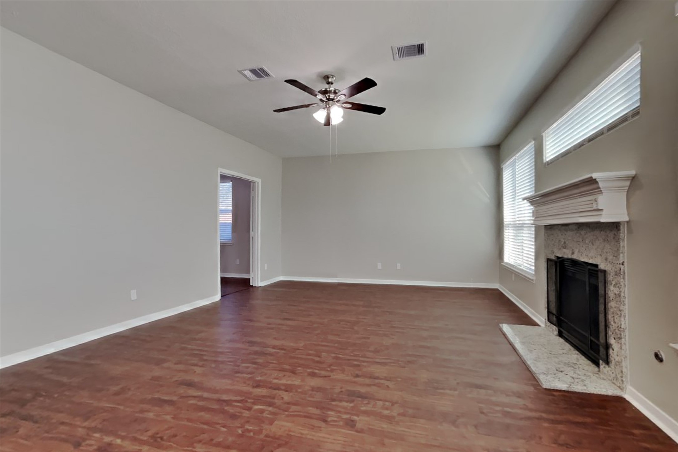 3242 Enchanted Hollow Lane Spring, TX 77388 - Photo 3 of 24 a view of an empty room with window and wooden floor