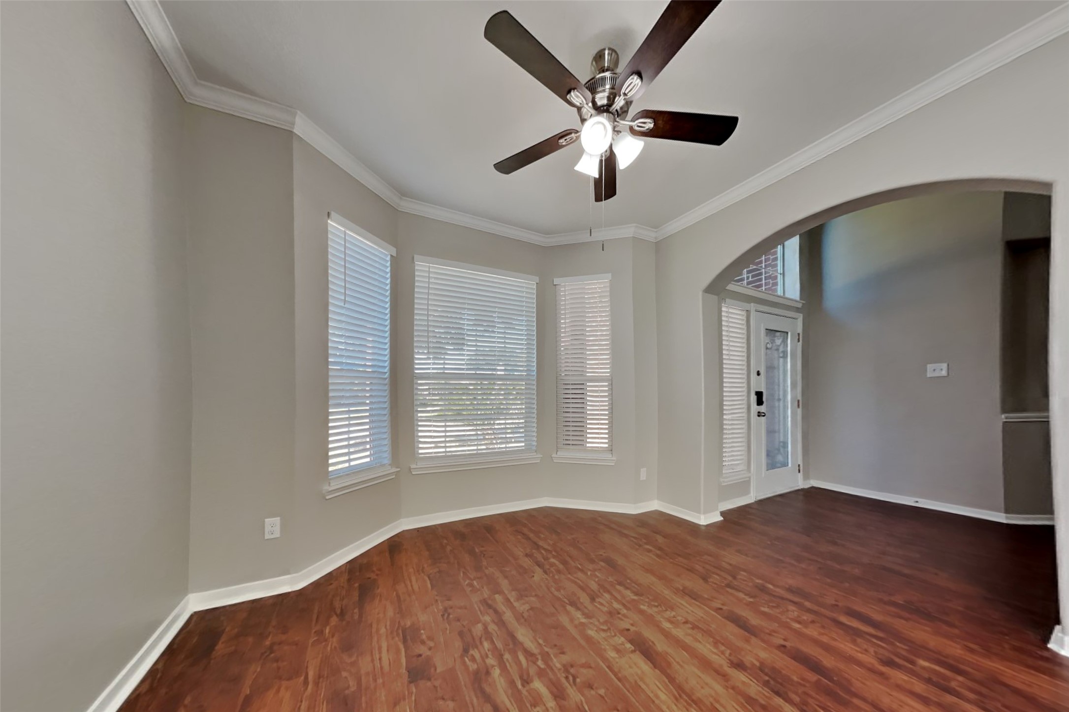 3242 Enchanted Hollow Lane Spring, TX 77388 - Photo 5 of 24 a view of an empty room with wooden floor and a window